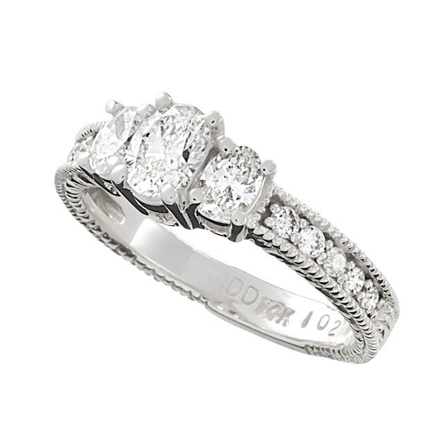 Three Stone Oval Diamond Ring With Side Diamonds And Engraving