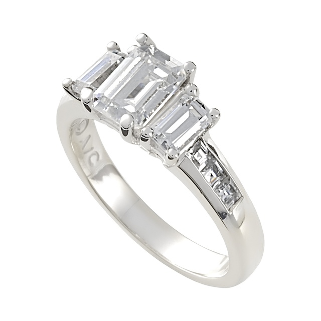 Three Stone Emerald Cut Diamond Ring With Channel Set Diamonds On The Side